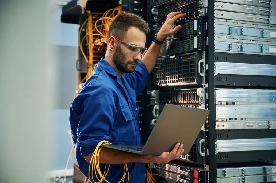 AV technician working on a server rack
